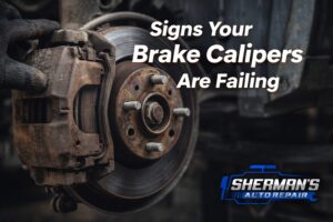 Rusty brake caliper and rotor showing signs of brake caliper failure at Sherman’s Auto Repair